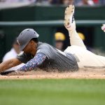 
              Washington Nationals' Juan Soto slides home as he scores on a sacrifice fly by Josh Bell during the third inning of a baseball game against the Milwaukee Brewers, Saturday, June 11, 2022, in Washington. (AP Photo/Nick Wass)
            