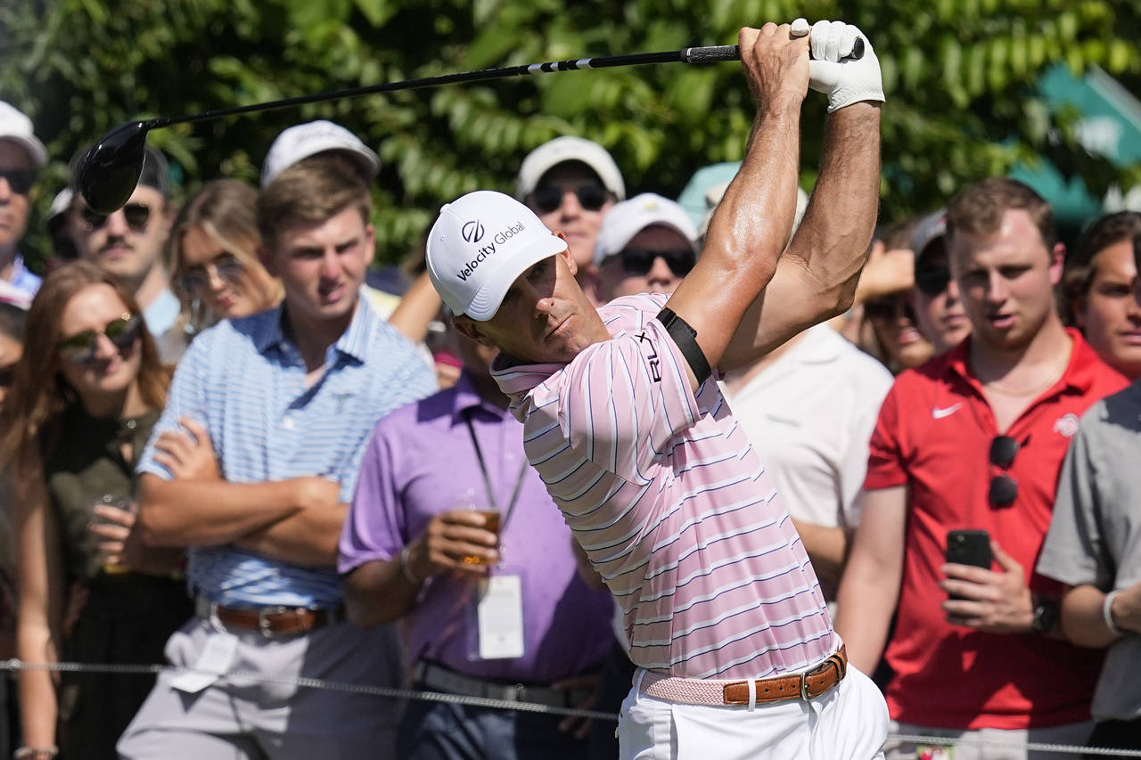 Billy Horschel drives from the 15th tee during the third round of the Memorial golf tournament Satu...