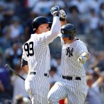 
              New York Yankees' DJ LeMahieu, right, celebrates with teammate Aaron Judge (99) after hitting a home run against the Houston Astros during the eighth inning of a baseball game, Sunday, June 26, 2022, in New York. (AP Photo/Noah K. Murray)
            