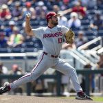 
              Arkansas starting pitcher Connor Noland (13) throws a pitch against Mississippi in the first inning during an NCAA College World Series baseball game Thursday, June 23, 2022, in Omaha, Neb. (AP Photo/John Peterson)
            