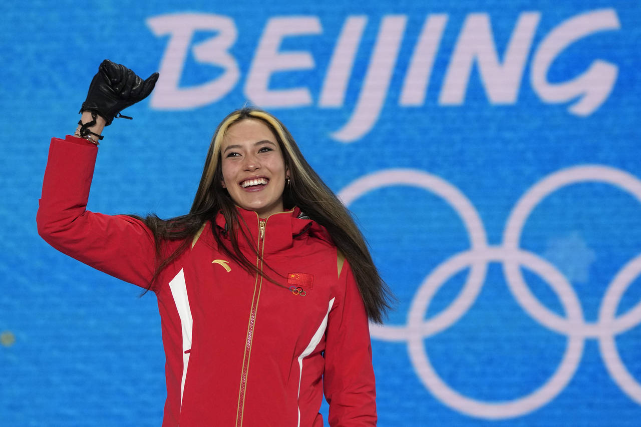 FILE - Gold medalist China's Eileen Gu celebrates during a medal ceremony for the women's freestyle...