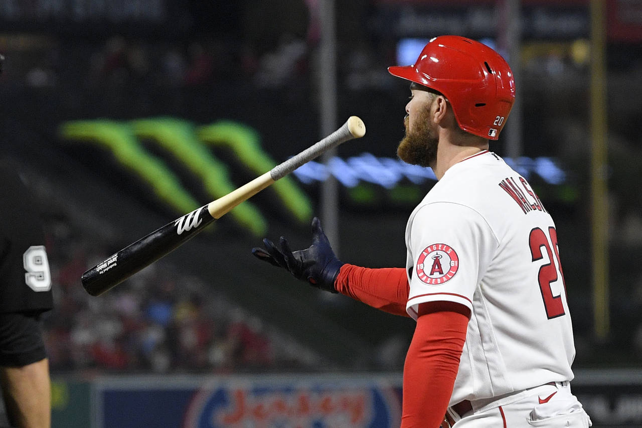 Los Angeles Angels' Jared Walsh flips his bat after striking out during the sixth inning of a baseb...