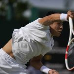 
              Brandon Nakashima of the US returns to Canada's Denis Shapovalov in a second round men's single match on day four of the Wimbledon tennis championships in London, Thursday, June 30, 2022. (AP Photo/Alastair Grant)
            