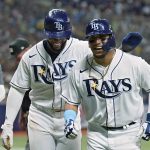 
              Tampa Bay Rays' Isaac Paredes, right, celebrates with Yandy Diaz after Paredes hit a two-run home run off New York Yankees pitcher Clarke Schmidt during the fifth inning of a baseball game Tuesday, June 21, 2022, in St. Petersburg, Fla. (AP Photo/Chris O'Meara)
            