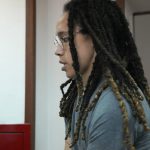 
              WNBA star and two-time Olympic gold medalist Brittney Griner is escorted to a courtroom for a hearing, in Khimki just outside Moscow, Russia, Monday, June 27, 2022. More than four months after she was arrested at a Moscow airport for cannabis possession, American basketball star Brittney Griner is to appear in court Monday for a preliminary hearing ahead of her trial. (AP Photo/Alexander Zemlianichenko)
            