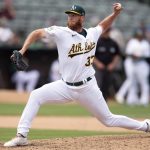 
              Oakland Athletics pitcher A.J. Puk (33) delivers against the Boston Red Sox during the eighth inning of a baseball game, Sunday, June 5, 2022, in Oakland, Calif. (AP Photo/D. Ross Cameron)
            