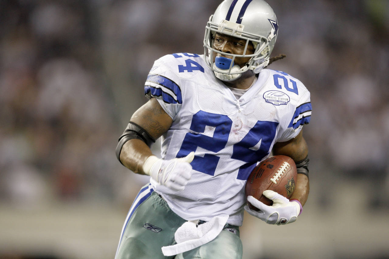 FILE - Dallas Cowboys running back Marion Barber III carries during the team's NFL football game ag...