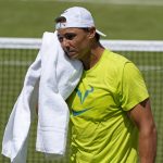 
              Spain's Rafael Nadal wipes his face with a towel as he practices ahead of the Wimbledon tennis championships in London, Sunday, June 26, 2022. (AP Photo/Alastair Grant)
            