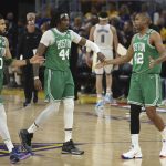 
              Boston Celtics forward Jayson Tatum (0) celebrates with center Robert Williams III (44) and center Al Horford (42) during the first half of Game 1 of basketball's NBA Finals against the Golden State Warriors in San Francisco, Thursday, June 2, 2022. (AP Photo/Jed Jacobsohn)
            