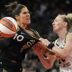 
              Chicago Sky guard Courtney Vandersloot, right, fouls Las Vegas Aces guard Kelsey Plum (10) during the second half of a WNBA basketball game Tuesday, June 21, 2022, in Las Vegas. (AP Photo/John Locher)
            