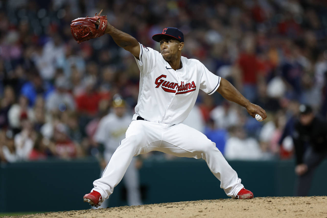 Cleveland Guardians relief pitcher Anthony Gose throws against the Oakland Athletics during the nin...