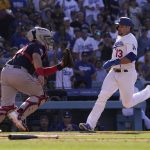 
              Los Angeles Dodgers' Max Muncy, right, scores on a double by Justin Turner as Cleveland Guardians catcher Austin Hedges waits for the ball during the third inning of a baseball game Saturday, June 18, 2022, in Los Angeles. (AP Photo/Mark J. Terrill)
            