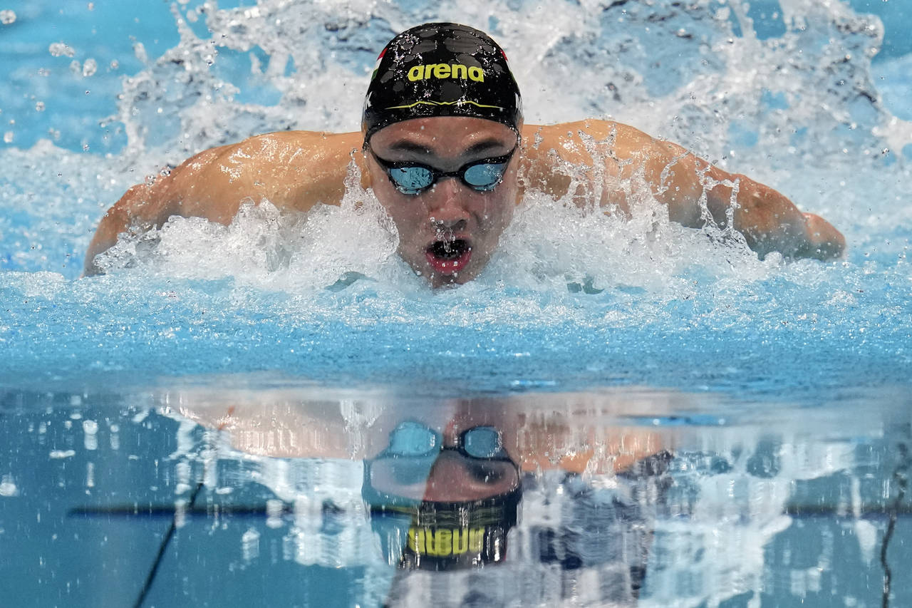 FILE - Kristof Milak, of Hungary, swims in a men's 100-meter butterfly semifinal at the 2020 Summer...