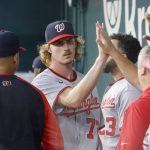 
              Washington Nationals starting pitcher Jackson Tetreault (72) is congratulated in the dugout after being pulled during the seventh inning of a baseball game against the Texas Rangers, Sunday, June 26, 2022, in Arlington, Texas. (AP Photo/Michael Ainsworth)
            