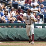 
              Texas A&M third baseman Trevor Werner throws to first for an out against Texas in the first inning during an NCAA College World Series baseball game Sunday, June 19, 2022, in Omaha, Neb. (AP Photo/John Peterson)
            