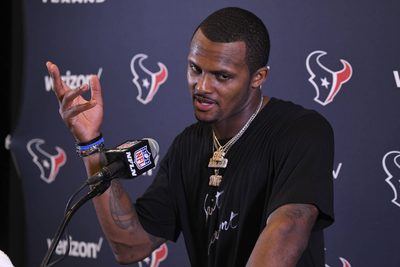 FILE - Houston Texans quarterback Deshaun Watson speaks during a news conference after an NFL footb...