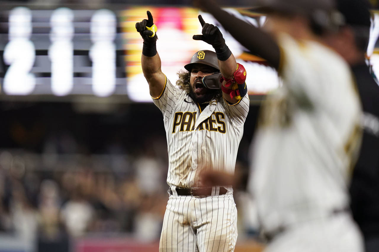San Diego Padres' Jorge Alfaro reacts after hitting a walk off single during the eleventh inning of...