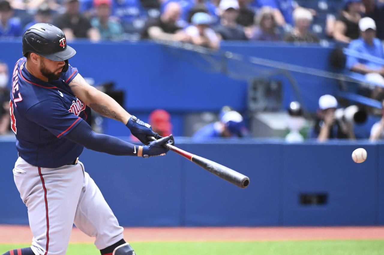 Minnesota Twins' Gary Sanchez hits a single against the Toronto Blue Jays in the first inning of a ...