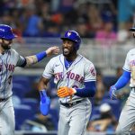 
              New York Mets' Tomas Nido, left, Starling Marte, center, and Brandon Nimmo celebrate after scoring on a double by Francisco Lindor during the sixth inning of the team's baseball game against the Miami Marlins, Friday, June 24, 2022, in Miami. (AP Photo/Lynne Sladky)
            