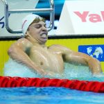 
              Leon Marchand of France celebrates after finishing first during the men's 400m medley final at the 19th FINA World Championships in Budapest, Hungary, Saturday, June 18, 2022. (AP Photo/Petr David Josek)
            