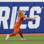
              Texas' Lauren Burke makes a catch in left field for an out during the sixth inning of an NCAA softball Women's College World Series game against Arizona on Sunday, June 5, 2022, in Oklahoma City. (AP Photo/Alonzo Adams)
            