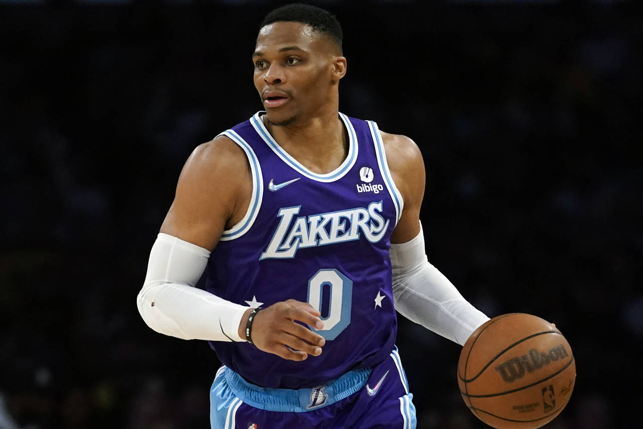 FILE - Los Angeles Lakers guard Russell Westbrook (0) controls the ball during an NBA basketball ga...
