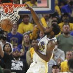 
              Golden State Warriors forward Andrew Wiggins (22) dunks against the Boston Celtics during the second half of Game 5 of basketball's NBA Finals in San Francisco, Monday, June 13, 2022. (AP Photo/Jed Jacobsohn)
            