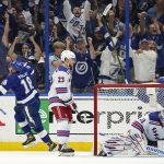 
              Tampa Bay Lightning left wing Ondrej Palat (18) reacts after scoring past New York Rangers goaltender Igor Shesterkin (31) during the third period in Game 3 of the NHL hockey Stanley Cup playoffs Eastern Conference finals Sunday, June 5, 2022, in Tampa, Fla. (AP Photo/Chris O'Meara)
            