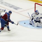 
              Colorado Avalanche right wing Valeri Nichushkin (13) scores on Tampa Bay Lightning goaltender Andrei Vasilevskiy (88) during the first period in Game 2 of the NHL hockey Stanley Cup Final, Saturday, June 18, 2022, in Denver. (AP Photo/John Locher)
            
