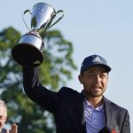 
              Xander Schauffele holds the trophy after winning the Travelers Championship golf tournament at TPC River Highlands, Sunday, June 26, 2022, in Cromwell, Conn. (AP Photo/Seth Wenig)
            