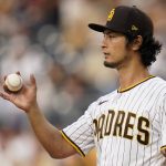 
              San Diego Padres starting pitcher Yu Darvish motions to teammates as he works against a New York Mets batter during the second inning of a baseball game Tuesday, June 7, 2022, in San Diego. (AP Photo/Gregory Bull)
            