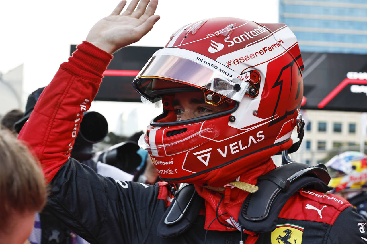 Ferrari driver Charles Leclerc of Monaco celebrates after setting the pole position in the qualifyi...