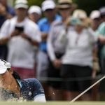
              Danielle Kang hits out of the bunker on the 18th hole during the second round of the U.S. Women's Open golf tournament at the Pine Needles Lodge & Golf Club in Southern Pines, N.C. on Friday, June 3, 2022. (AP Photo/Chris Carlson)
            