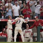 
              Fans cheer as Los Angeles Angels' Mike Trout is congratulated for his home run during the third inning of the team's baseball game against the Chicago White Sox on Tuesday, June 28, 2022, in Anaheim, Calif. (AP Photo/Jae C. Hong)
            
