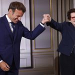 
              French President Emmanuel Macron holds the hand of tennis legend Billie Jean King, of the U.S, after she was awarded with the Legion d'Honneur at the Elysee Palace Friday, June 3, 2022 in Paris. A ceremony Thursday at the Roland Garros stadium marked the 50th anniversary of her French Open win.(AP Photo/Jean-Francois Badias, Pool)
            