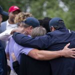 
              Survivors of the 9/11 attacks and several family members of some of its victims embrace each other after a news conference at the North Plains Veterans Park in North Plains, Ore. Thursday, June 30, 2022. The Saudi Arabia-backed LIV Golf tour teed off Thursday, angering a group of families who lost loved ones on Sept. 11 and want the Saudi government held to account for the terrorist attacks. (Beth Nakamura/The Oregonian via AP)
            