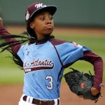 
              FILE - In this Aug. 15, 2014, file photo, Pennsylvania's Mo'ne Davis throws a pitch in the fifth inning against Tennessee during a baseball game in United States pool play at the Little League World Series tournament in South Williamsport, Pa. (AP Photo/Gene J. Puskar, File)
            