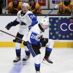 
              Saint John Sea Dogs' William Dufour, right, celebrates his fourth goal against the Shawinigan Cataractes, during the third period of a Memorial Cup hockey game Saturday, June 25, 2022, in Saint John, New Brunswick. (Darren Calabrese/The Canadian Press via AP)
            