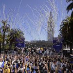 
              The Golden State Warriors pose for a group photo before the start of their NBA championship parade in San Francisco, Monday, June 20, 2022. (AP Photo/Eric Risberg)
            