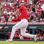 
              Cincinnati Reds' Kyle Farmer (17) hits a two-run single during the first inning of a baseball game against the Washington Nationals Saturday, June 4, 2022, in Cincinnati. (AP Photo/Jeff Dean)
            