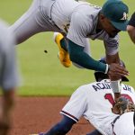 
              Atlanta Braves' Ronald Acuna Jr. (13) is tagged out by Oakland Athletics second baseman Tony Kemp (5) as he tried to steal second base during the first inning of a baseball game Wednesday, June 8, 2022, in Atlanta. (AP Photo/John Bazemore)
            