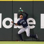 Seattle Mariners center fielder Julio Rodriguez catches a flyout against Texas Rangers Eli White during the third inning of a baseball game in Arlington, Texas, Saturday, June 4, 2022. (AP Photo/LM Otero)