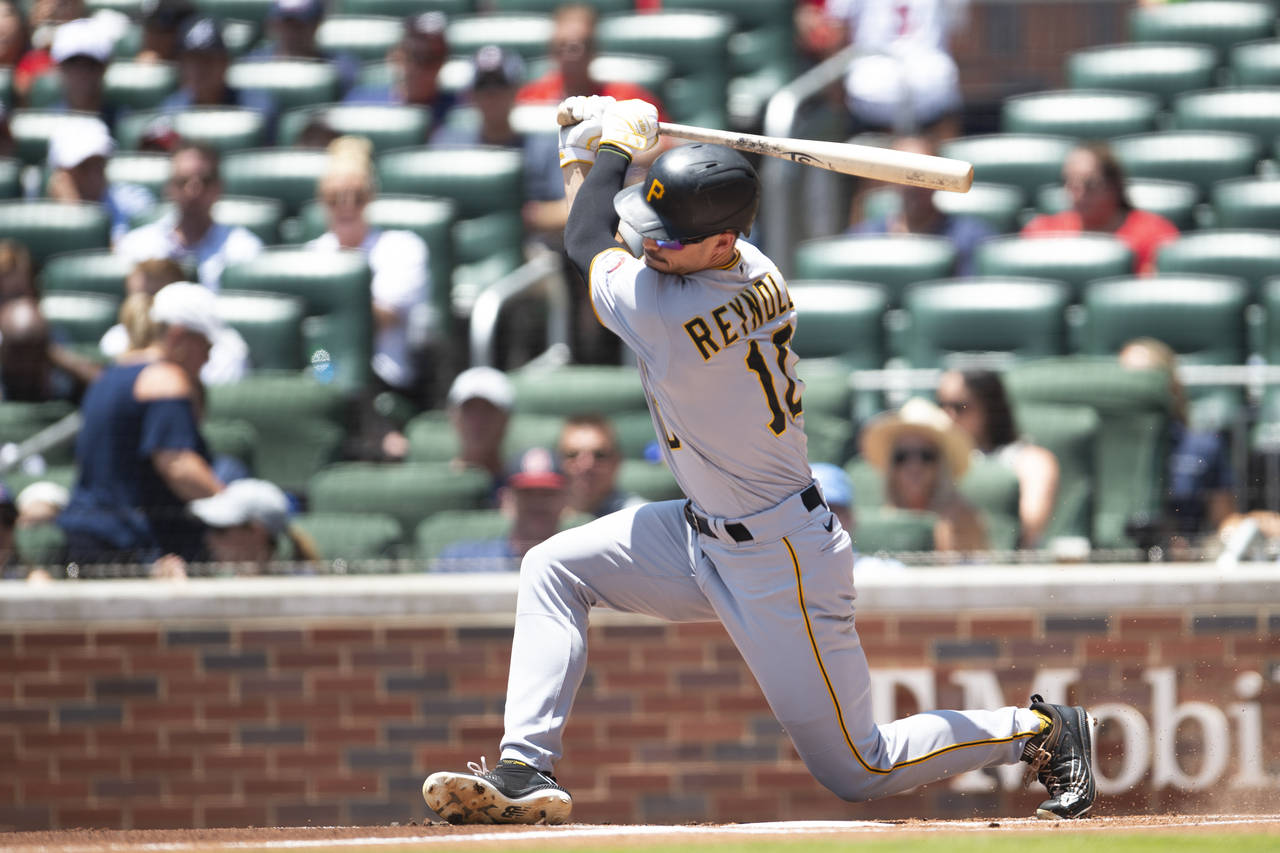 Pittsburgh Pirates' Bryan Reynolds (10) swings at pitch in the first inning of a baseball game agai...