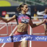 
              Sydney McLaughlin crosses the finish line to set a new world record in the women's 400 meter hurdles at the U.S. outdoor track and field championships, Saturday, June 25, 2022, in Eugene, Ore. (Chris Pietsch/The Register-Guard via AP)
            