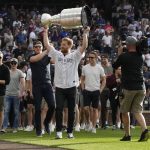 
              Colorado Avalanche captain Gabriel Landeskog holds up the Stanley Cup as the NHL hockey team was honored by the Colorado Rockies before the baseball team's game against the Los Angeles Dodgers on Wednesday, June 29, 2022, in Denver. (AP Photo/David Zalubowski)
            