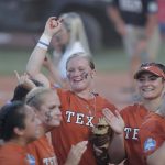 
              Texas' Alyssa Washington (11) celebrates after her team defeated Oklahoma State in an NCAA softball Women's College World Series game on Monday, June 6, 2022, in Oklahoma City. (AP Photo/Alonzo Adams)
            