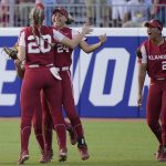 
              Oklahoma's Jayda Coleman celebrates with Jana Johns (20) after catching a fly ball hit by Texas' Mary Iakopo during the first inning of the second game of the NCAA softball Women's College World Series finals Thursday, June 9, 2022, in Oklahoma City. (AP Photo/Sue Ogrocki)
            