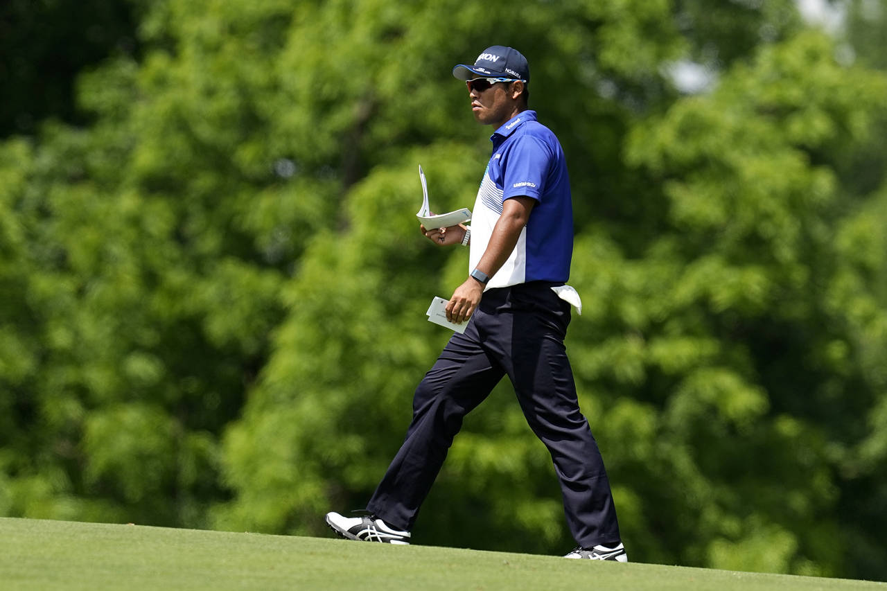 Hideki Matsuyama, of Japan, walks on the ninth fairway during the first round of the Memorial golf ...