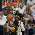 
              Golden State Warriors guard Jordan Poole (3) puts up a shot against Boston Celtics center Robert Williams III during the second quarter of Game 4 of basketball's NBA Finals, Friday, June 10, 2022, in Boston. (AP Photo/Steven Senne)
            
