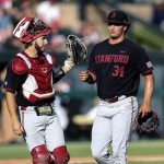 
              Stanford's Kody Huff, left, high-fives Ryan Bruno, right, after the sixth inning of an NCAA college baseball super regional game against Connecticut Sunday, June 12, 2022, in Stanford, Calif. (AP Photo/Kavin Mistry)
            